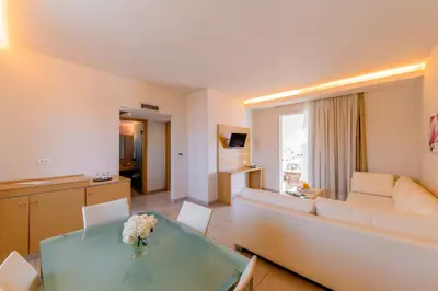 a living room with a couch and a table at Afandou Bay Resort Suites in Afantou