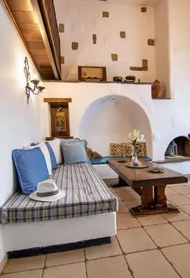 a living room with a couch and a table at Nostalgia Suites in Faliraki