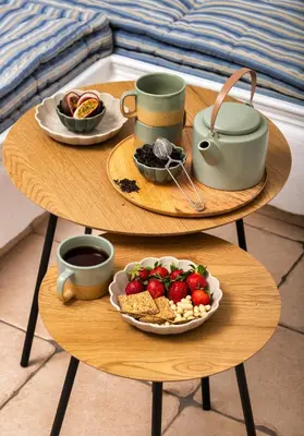a table with a plate of food and a plate of fruit at Nostalgia Suites in Faliraki