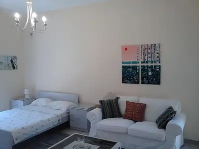 a living room with a couch and a bed at Park House -beside the Medieval Town of Rhodes-free parking in Rhodes Town
