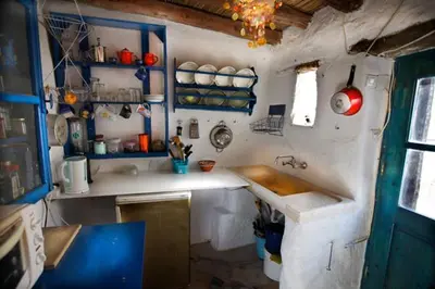 a small kitchen with a sink and a counter at Clive and Bifi's house in Lachania