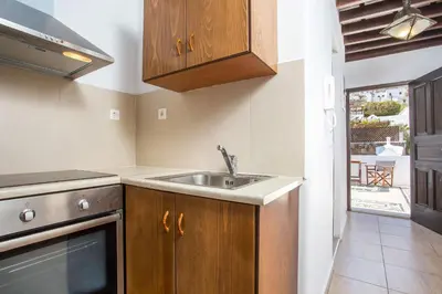 a kitchen with a sink and a stove at CasaLindos Festa in Líndos