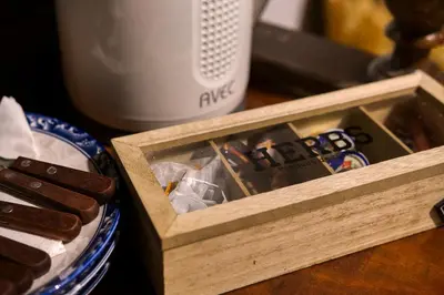 a wooden box filled with hot dogs on a table at Mascot Garden Rooms in Rhodes Town