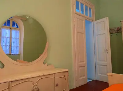 a dressing room with a mirror and a dresser at Romantic rooms with stunning sea view in Rhodes Town