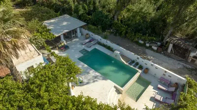 an overhead view of a swimming pool in a house at Oliveyard Stone Built House- with pool non chlorin in Koskinou