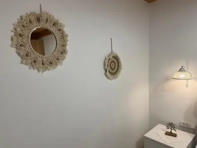 a bathroom with a mirror on the wall at La Casa de Tsampika in Koskinou