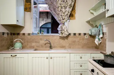 a kitchen with a sink and a window at A33 Rhodes Old Town House in Rhodes Town