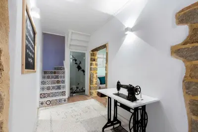 a sewing machine sits on a table in a room at A33 Rhodes Old Town House in Rhodes Town