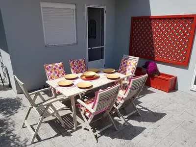 a dining room table with four chairs around it at Villa Anastasia in Gennadi