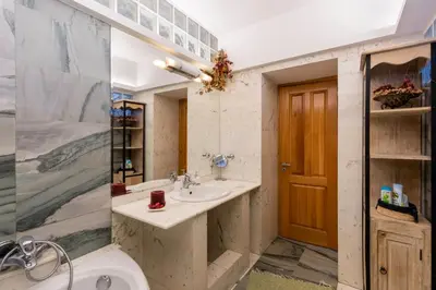 a bathroom with a sink and a toilet at Rhodes Sunrise Maisonette in Koskinou