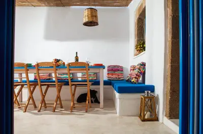 a dining room with a table and two chairs at Villa Kefi in Koskinou