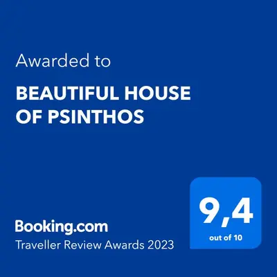 a blue sign with the words awarded to a beautiful house of pirmos at BEAUTIFUL HOUSE OF PSINTHOS in Psinthos