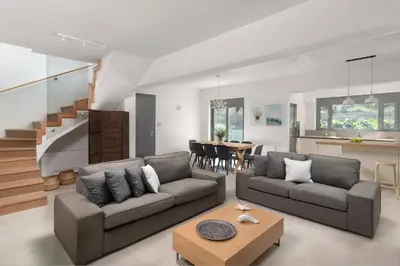 a living room with two couches and a table at Terpsis Pool Villa in Rhodes Town