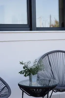 a potted plant sitting on a table in front of a window at Green horizon villa in Asgourou