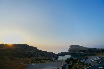 a view of a harbor with boats in the water at St. Paul's Bay View Suites in Líndos