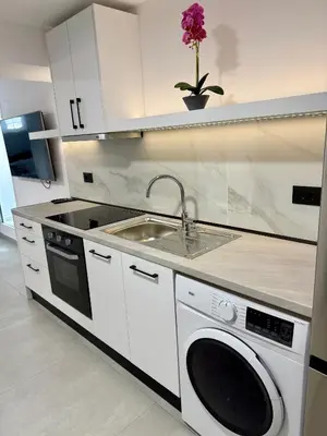 a kitchen with a sink and a dishwasher at Villa 56 Luxury apartments in Rhodes Town