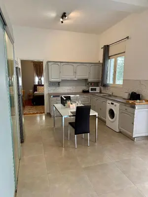 a kitchen with a table and a dining room at Villa 56 Luxury apartments in Rhodes Town