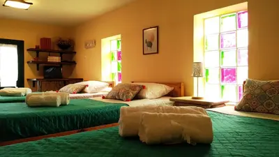 a room with three beds in a room with windows at Dora's House in Ístrios