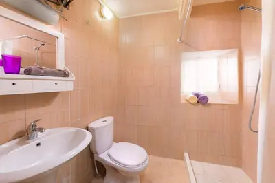a bathroom with a toilet and a sink at Colourful Home, Medieval Town Rhodes in Rhodes Town