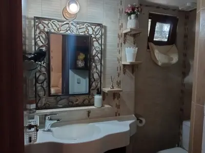 a bathroom with a sink and a mirror at Nikelen Lindian Exclusive Apartments in Líndos