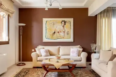 a living room with a couch and a table at Savvinas House Faliraki-Traganou Beach in Faliraki