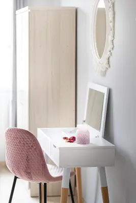 a white desk with a mirror and a pink chair at TownHall Apartment's in Rhodes Town