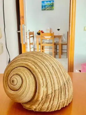 a coil of rope sitting on top of a table at Nitsa's Apartments in Megálon Choríon