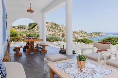 a living room with a view of the ocean at Anatoli Traditional Villa in Archangelos
