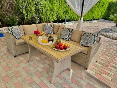 a table with fruit on top of a patio at Nicole Luxury Villas in Koskinou