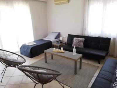 a living room with a couch and a table at Casa Dama in Rhodes Town