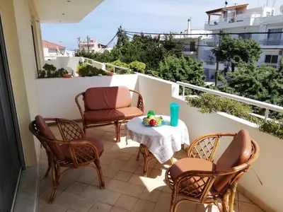 a balcony with chairs and a table on a balcony at Casa Dama in Rhodes Town