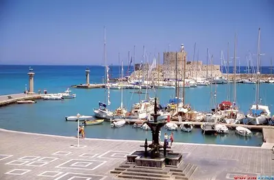 a marina with a bunch of boats in the water at Villa Olive Grove in Afantou