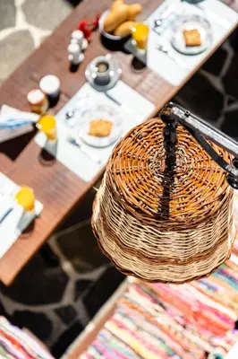 a picnic table with a basket on top of it at Koskinou Traditional Houses in Koskinou