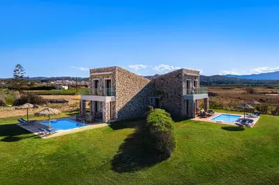 an external view of a house with a swimming pool at Diagoras & Attalos Villas in Phanaes
