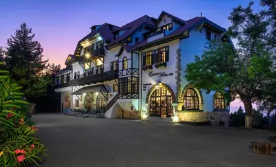 a large white building with a lot of windows at Elafos Hotel in Sálakos