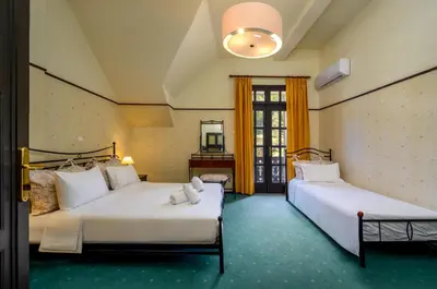 two beds in a room with two beds sidx sidx sidx sidx at Elafos Hotel in Sálakos