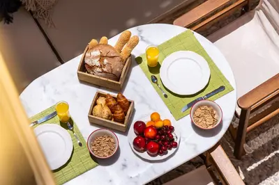 a white table with food on top of it at Villa il Vecchio Cortile in Rhodes Town