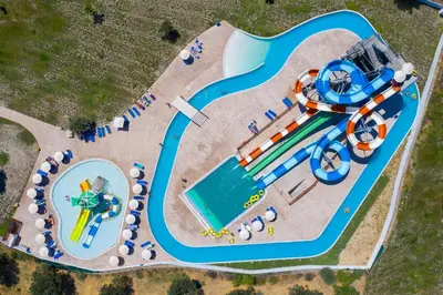 an overhead view of a water park with a water slide at Olive Garden Hotel in Lardos