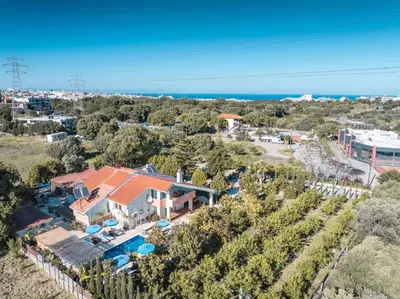 an aerial view of a house with the ocean in the background at Artzy Villa in Rhodes Town