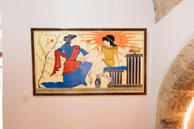 a painting of two women on a wall at Athina house in Rhodes Town