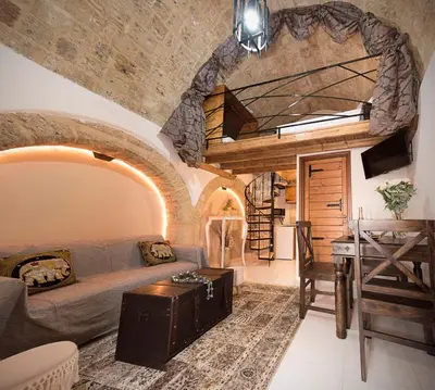a living room with a couch and a table at Athina house in Rhodes Town