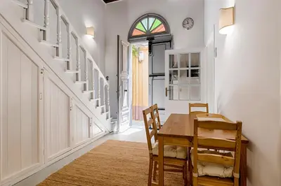 a dining room with a wooden table and chairs at Casa Elettra in Rhodes Town