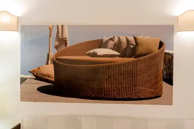 a wicker basket with pillows in a room at Casa Elettra in Rhodes Town