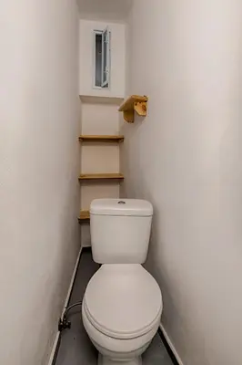 a bathroom with a white toilet in a room at Casa Elettra in Rhodes Town