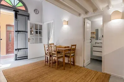 a kitchen and dining room with a table and chairs at Casa Elettra in Rhodes Town