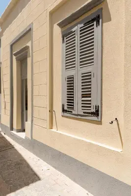 a window on the side of a building at Casa Elettra in Rhodes Town