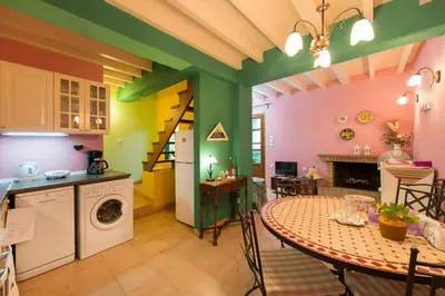a kitchen and a dining room with a table and a stove at Old Town House with Garden, Fully Equipped & Peaceful in Rhodes Town