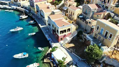 an aerial view of a city with boats in the water at Moschos Mansion in Symi