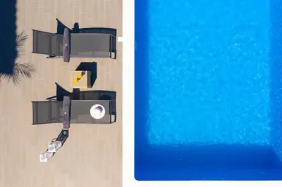 an overhead view of a swimming pool next to a pool at Costa Costa Villa - Luxury villa in Kolimbia