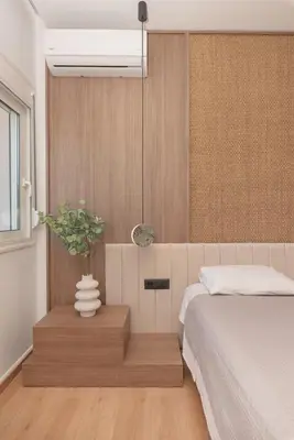 a bedroom with a bed and a vase with a plant at M & S Villa - 4 bedroom villa with heated pool in Pastida